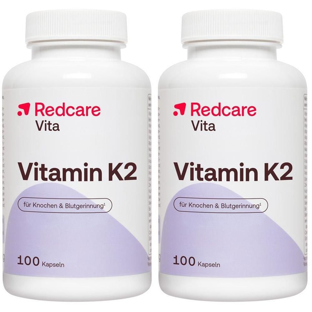 Deux flacons blancs Redcare Vita Vitamine K2, chacun contenant 100 gélules.