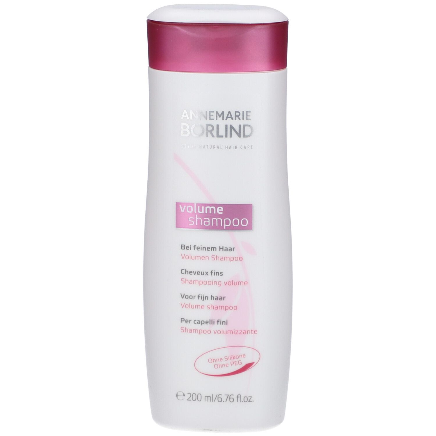 Shampooing blanc avec bouchon violet. Inscription: ANNEMARIE BÖRLIND, Volume Shampoo. Texte multilingue.