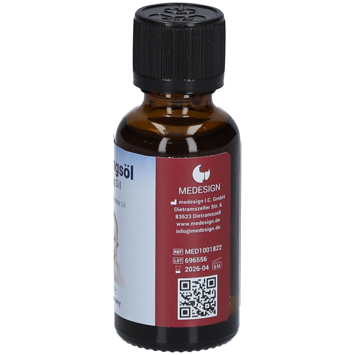 Flacon en verre brun avec bouchon noir. Étiquette avec informations produit et logo. Code QR et numéro de lot.