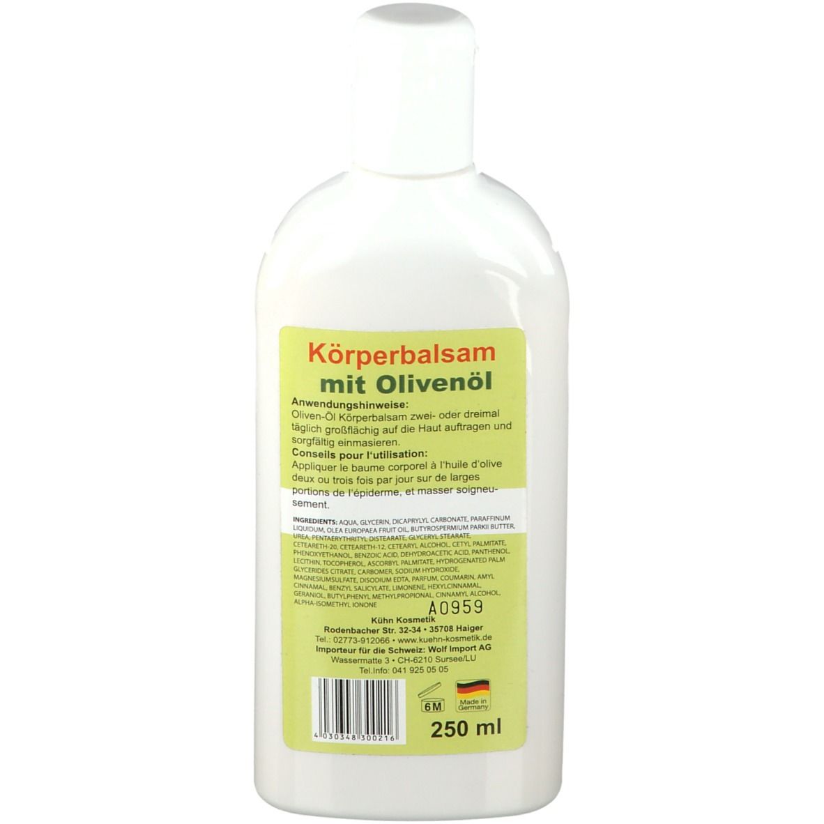 Achterkant van de fles. Groen etiket met tekst: Köperbalsam mit Olivenöl. Ingrediënten en gebruiksaanwijzing.