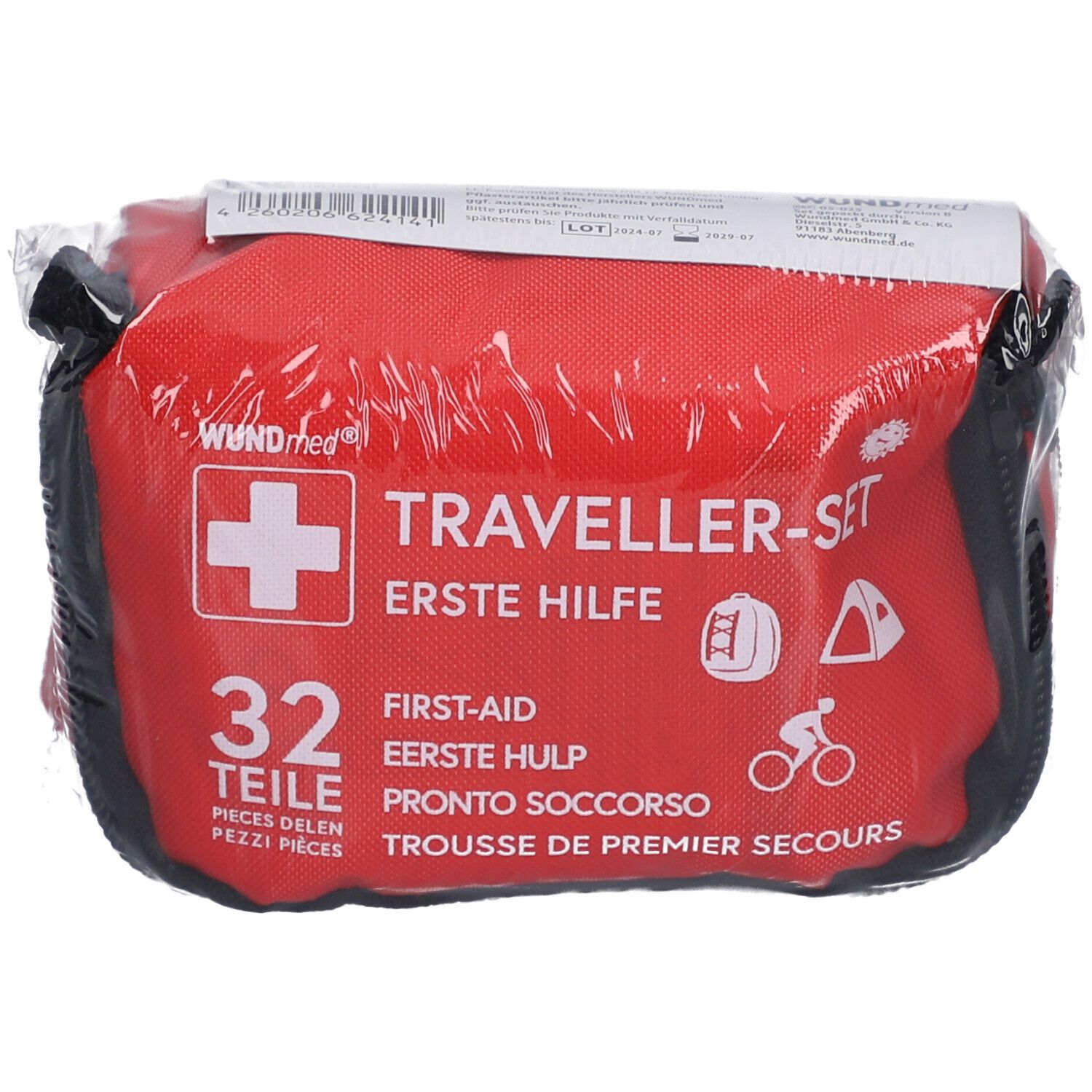 Rode tas met wit kruis en opschrift 'Traveller-Set'. Bevat 32 delen. Verpakt in folie.