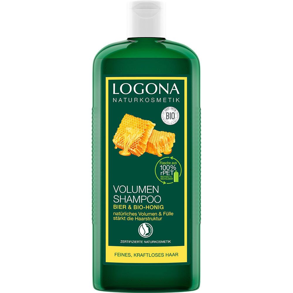 Flacon de shampooing vert avec bouchon blanc. Étiquette avec logo, illustration de rayons de miel et texte: Volumen Shampoo Bier & Bio-Honig.