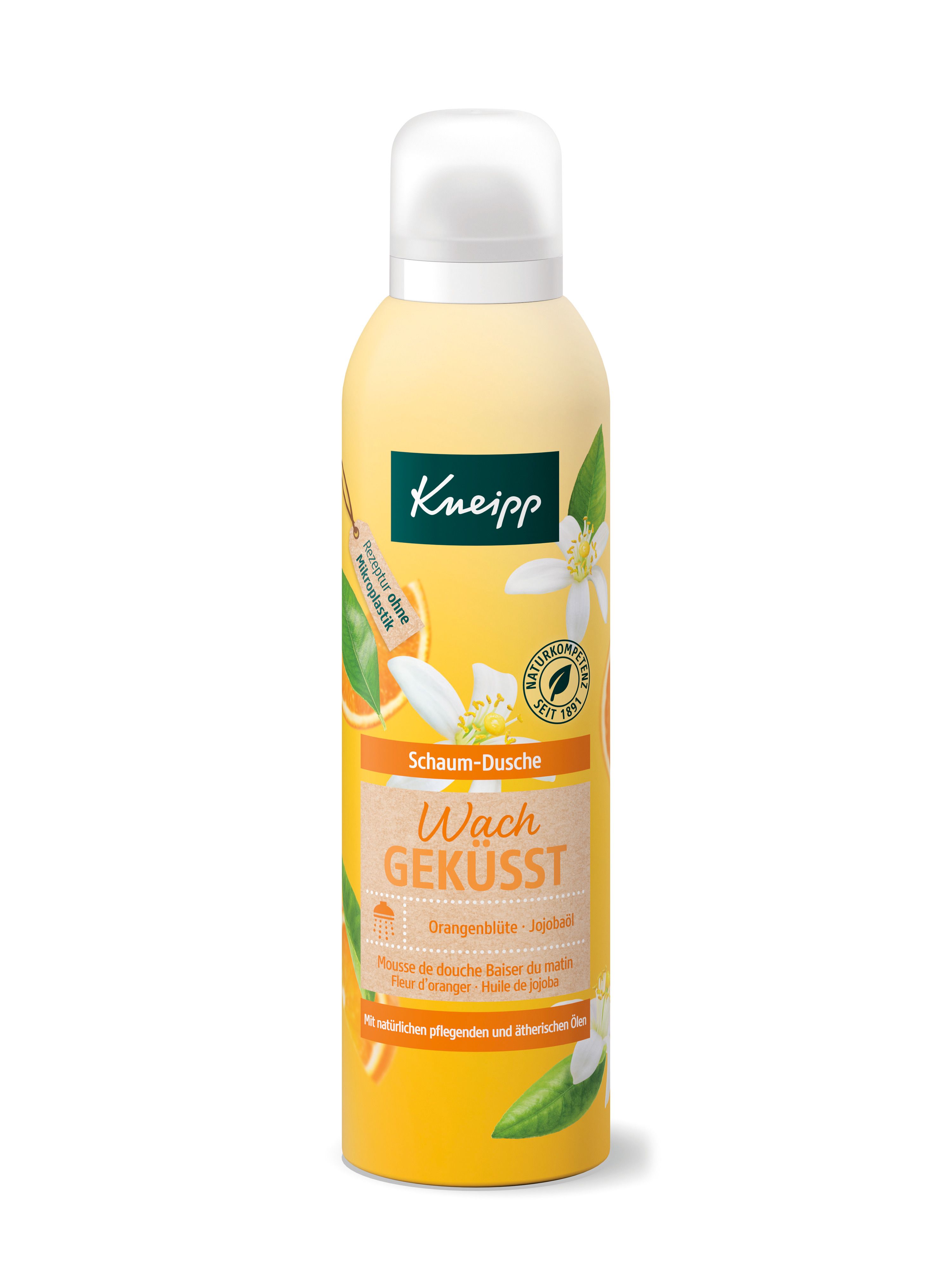 Gele fles met witte dop. Opschrift: Kneipp Schaum-Dusche Wachgeküsst. Sinaasappelbloesem motief.