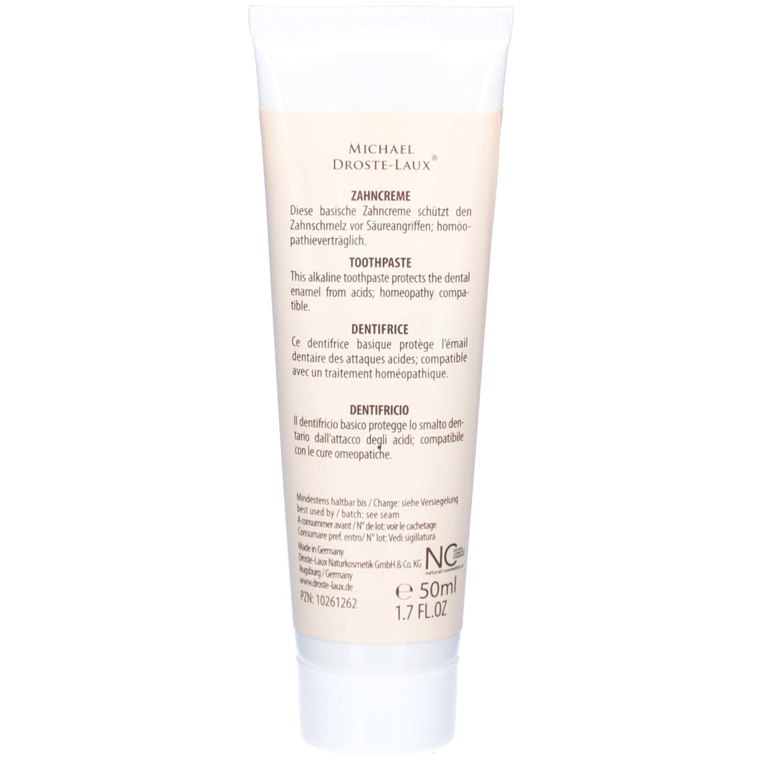 Dos du tube de dentifrice. Texte: Ce dentifrice basique protège l'émail dentaire. Ingrédients, informations fabricant, numéro de lot, 50ml.
