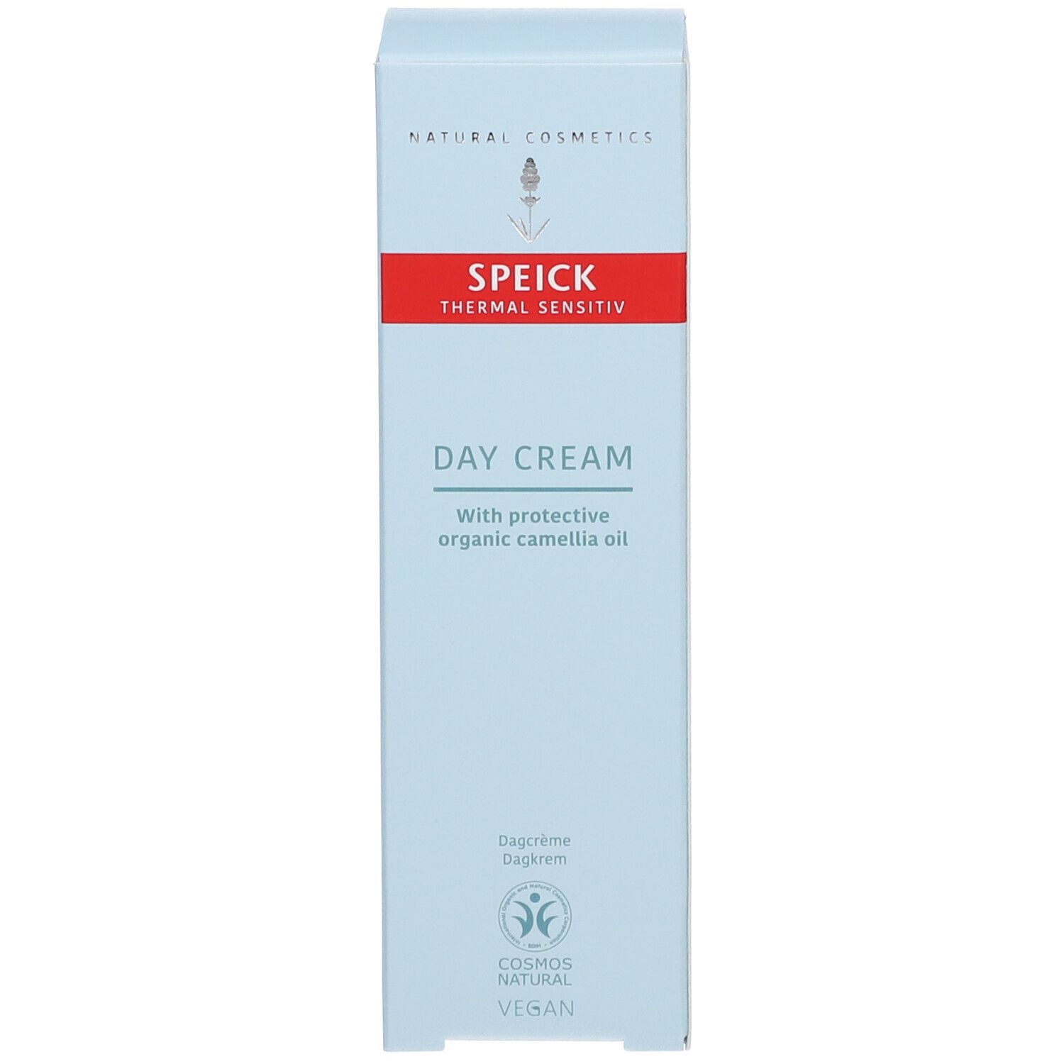 Boîte bleu clair avec bande rouge. Inscription : DAY CREAM. Sceau végétalien.