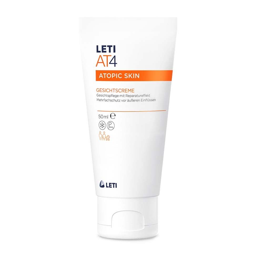 Tube blanc de crème pour le visage LETI AT4. Bande orange avec texte. Nom du produit et informations sur le tube.