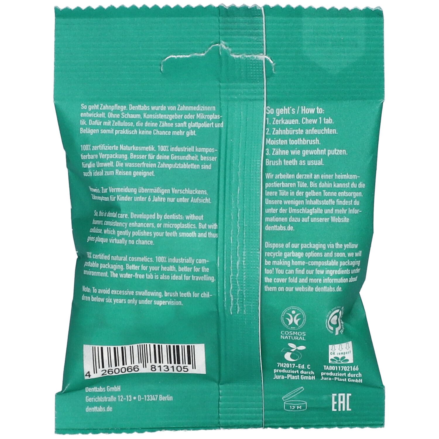 Achterkant van de groene "denttabs." verpakking met tekst en logo's. Bevat informatie over gebruik en ingrediënten.