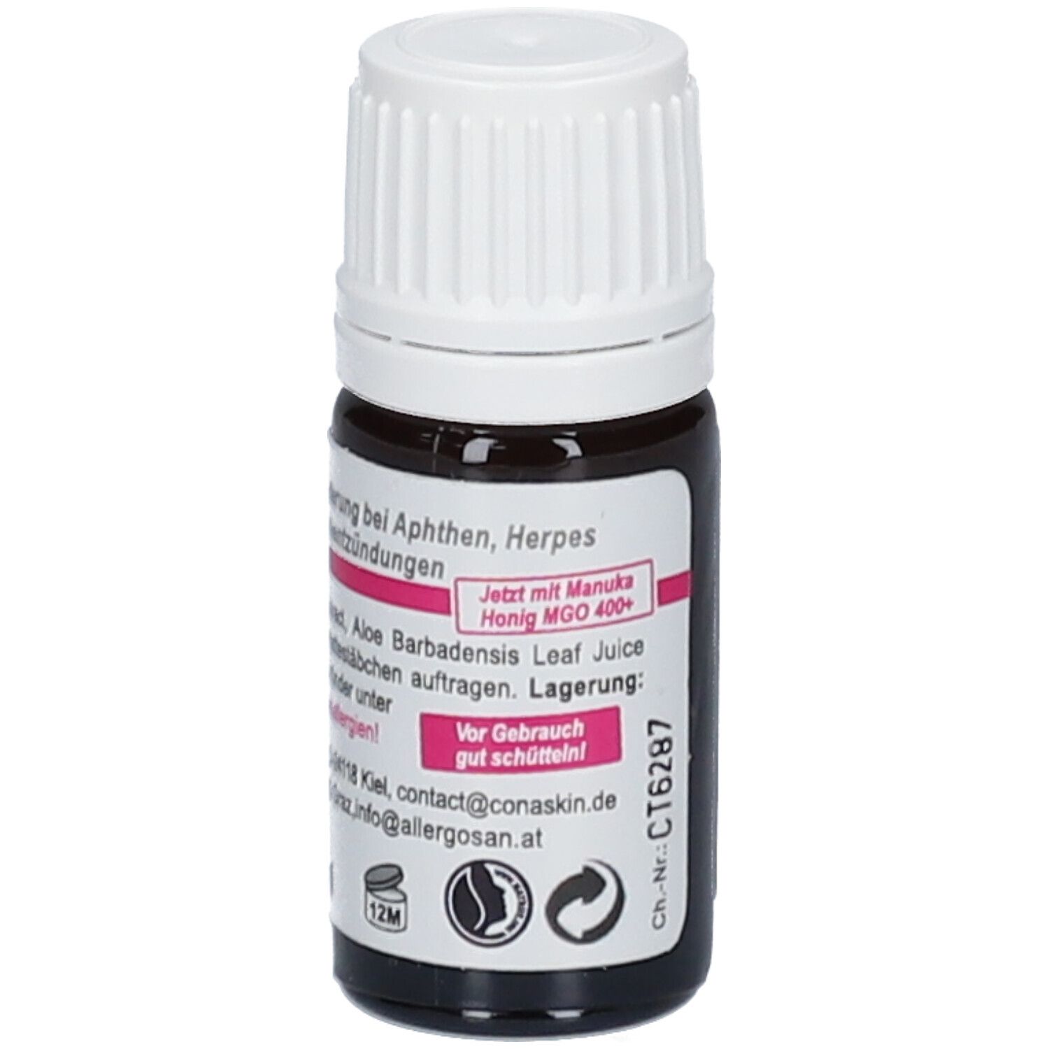 Bruine glazen fles met witte dop. Etiket met productnaam en ingrediënten. Tekst over Manuka honing.