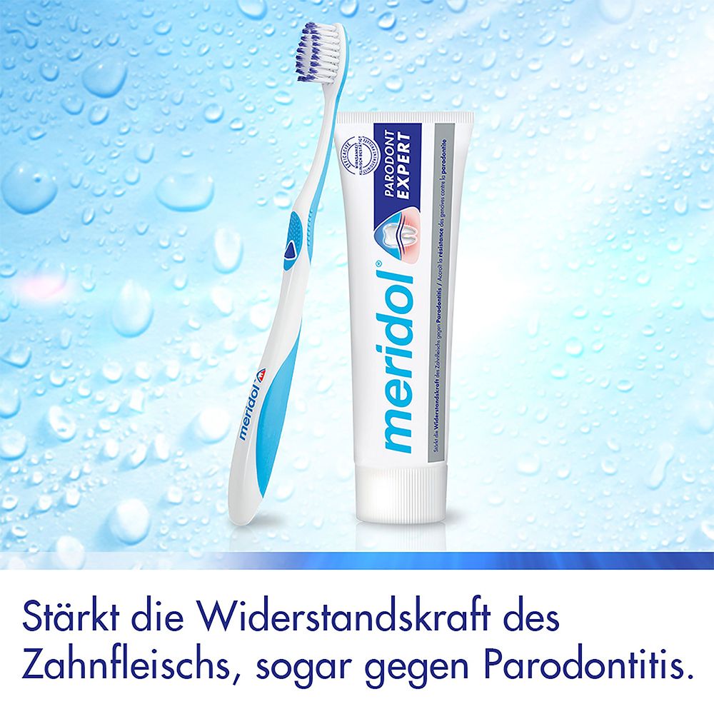 Brosse à dents et dentifrice. Texte : 'meridol Parodont Expert'. Fond : gouttes d'eau.