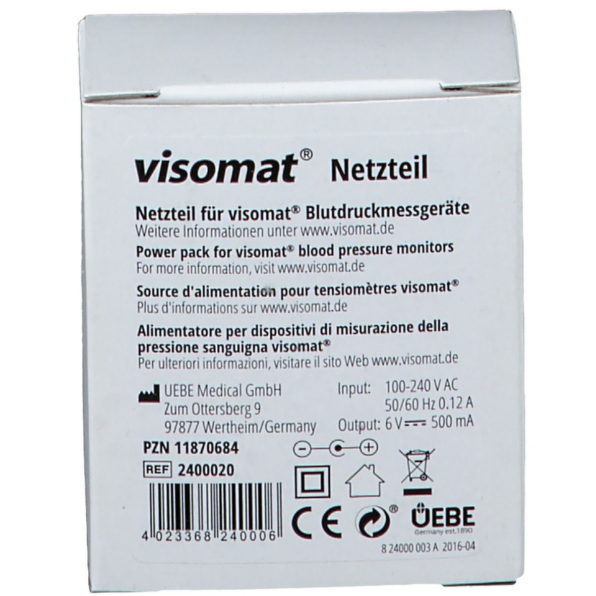 Witte verpakking met productinformatie. Bovenaan "visomat® Netzteil". Tekst in het Duits, Engels, Frans en Italiaans. CE-markering.