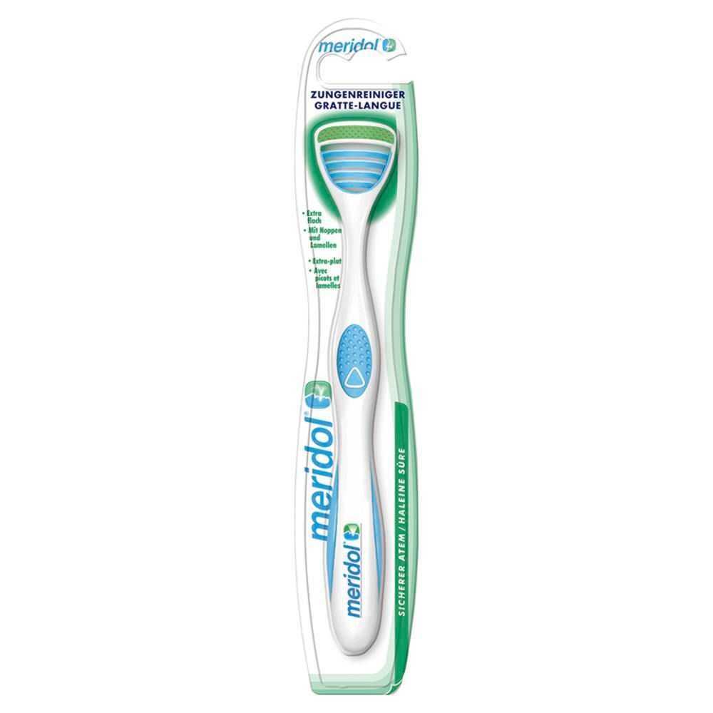 Tongreiniger in blisterverpakking. Witte handgreep, blauw accent, groen reinigingsgedeelte. Merk meridol.