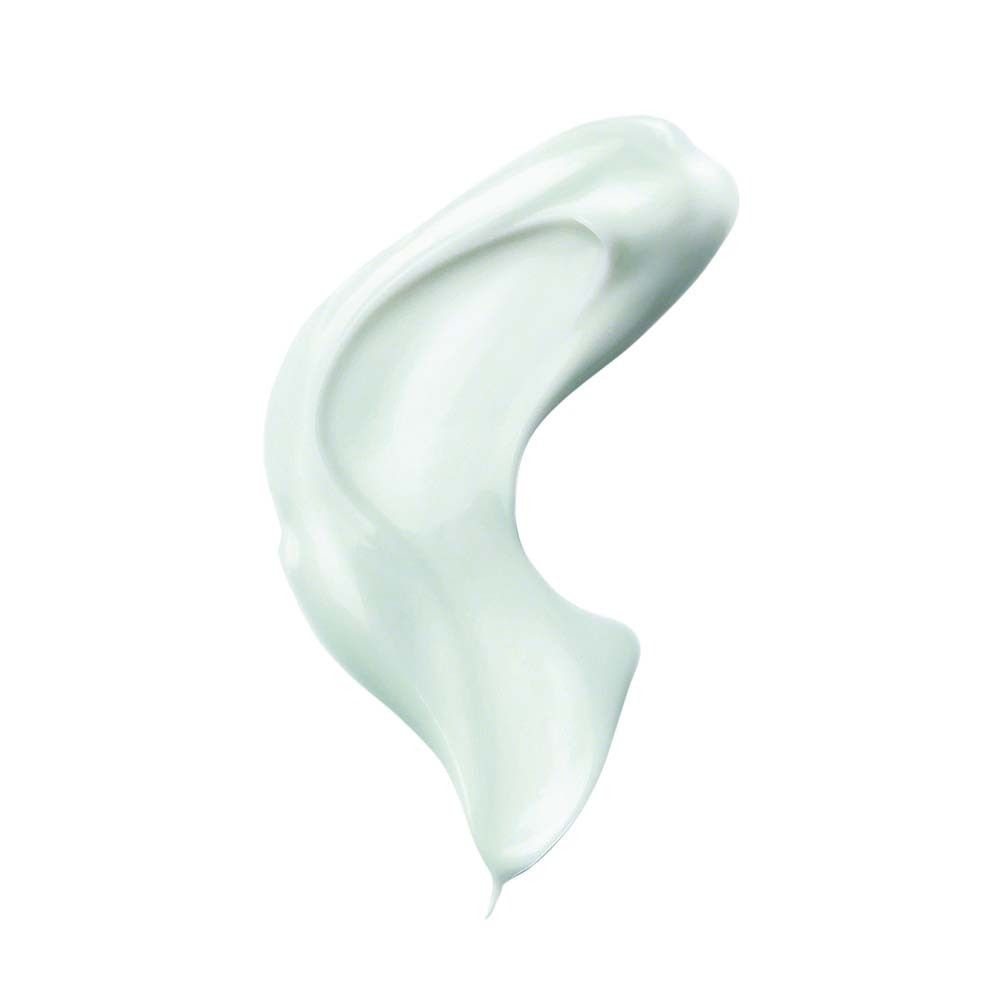 Échantillon de crème vert clair sur fond blanc. Forme de goutte.