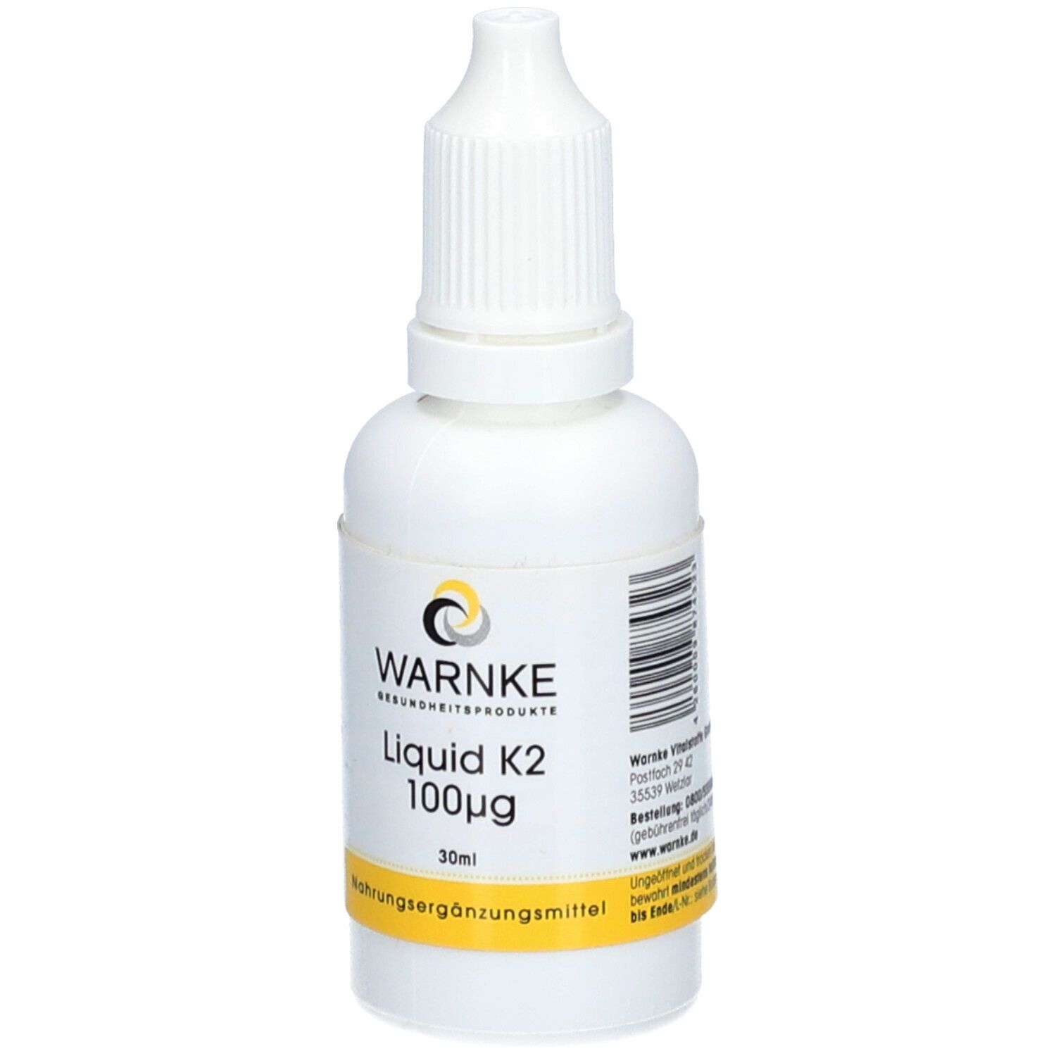 Flacon blanc avec compte-gouttes. Inscription: WARNKE, Liquid K2 100µg, 30ml. Code-barres. Étiquette jaune: Complément alimentaire.