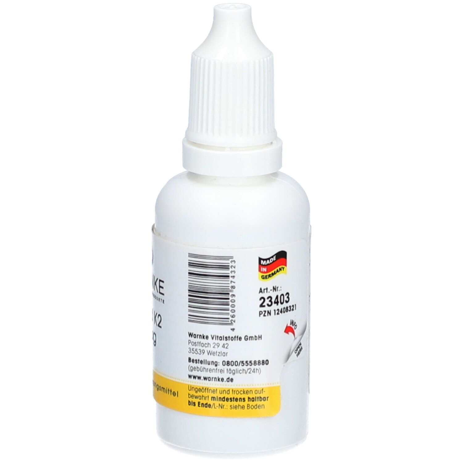 Flacon blanc avec compte-gouttes. Autocollant avec texte et code-barres. Fabriqué en Allemagne. Étiquette jaune: Complément alimentaire.