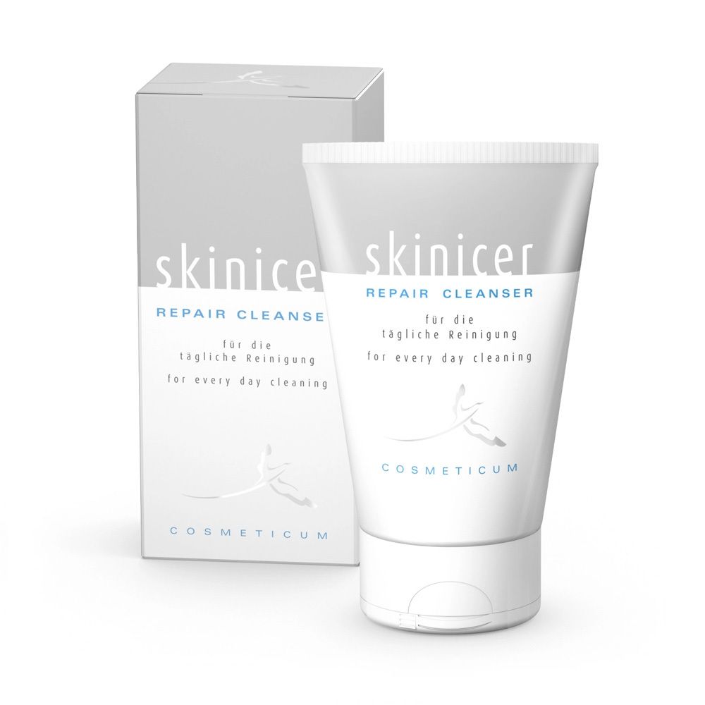 Tube et boîte Skinicer Repair Cleanser avec inscription 'für die tägliche Reinigung'.