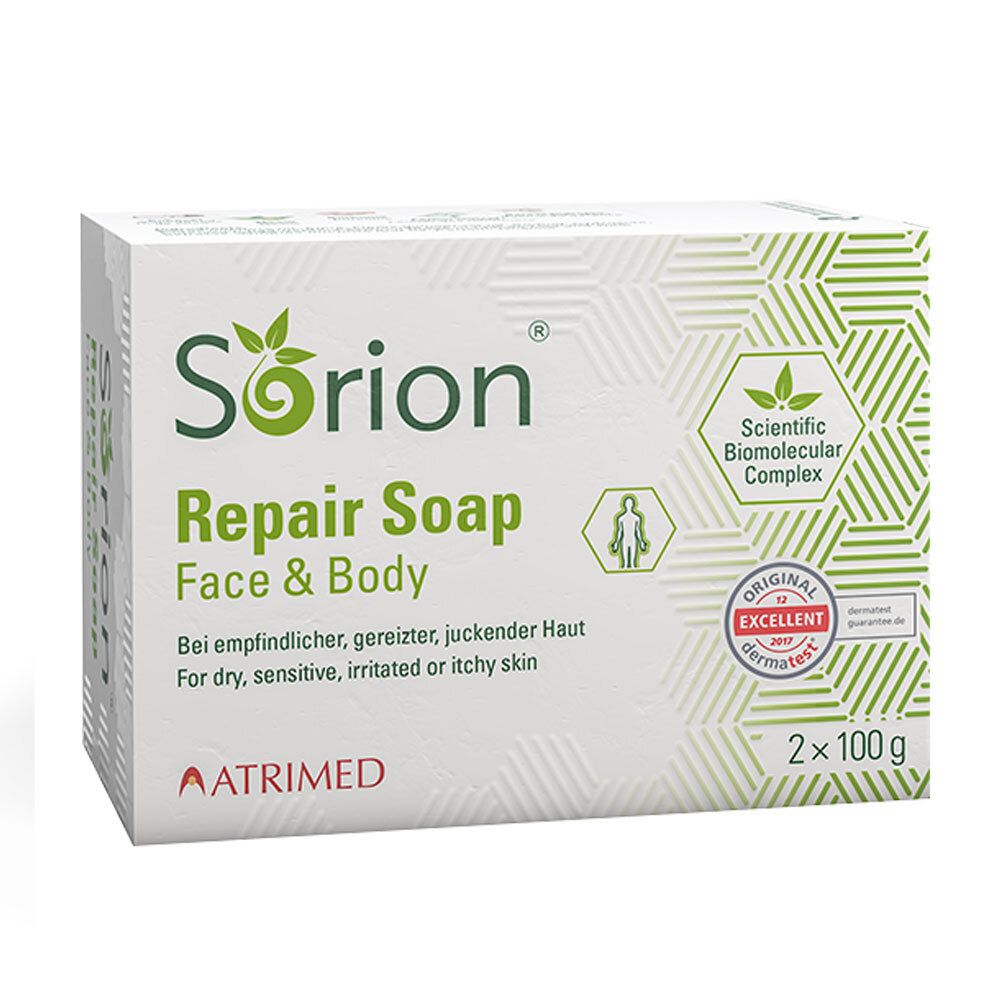 Boîte blanche SORION Repair Soap. Texte: Face & Body, pour peaux sèches, sensibles, irritées. Label Dermatest.