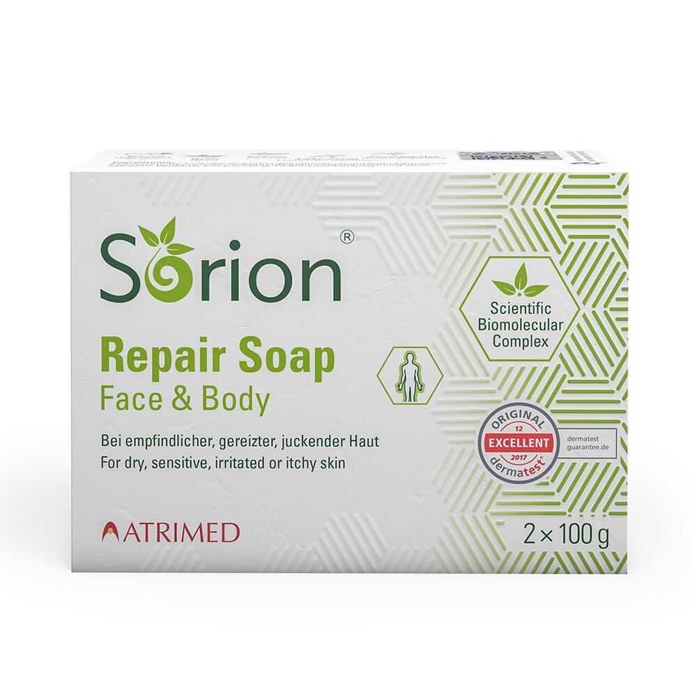 Boîte blanche SORION Repair Soap. Texte: Face & Body, pour peaux sèches, sensibles, irritées. Label Dermatest.