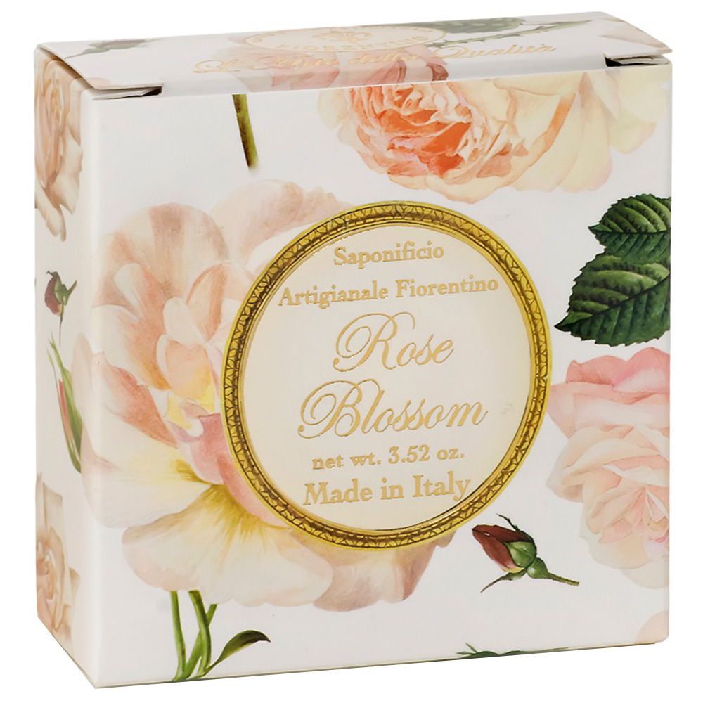 Boîte en carton avec motif de roses. Inscription : Rose Blossom, Made in Italy. Cadre doré avec nom de la marque.