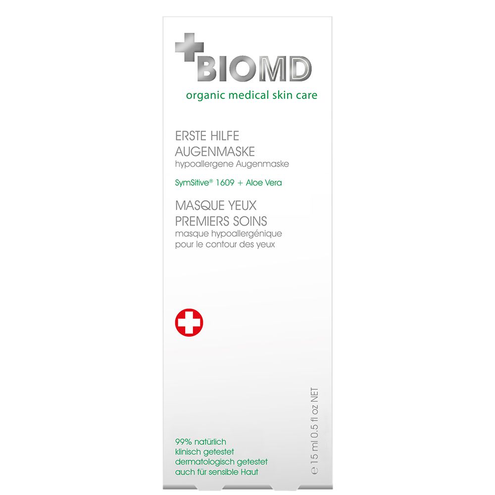 Tube blanche BIOMD. Texte vert et croix rouge. Masque yeux premiers soins, hypoallergénique.