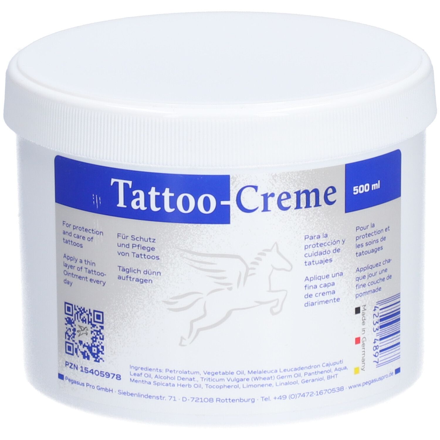 Pot blanc avec étiquette bleue. Inscription: Tattoo-Creme. Logo Pegasus. Texte en allemand, espagnol et français. Code QR.