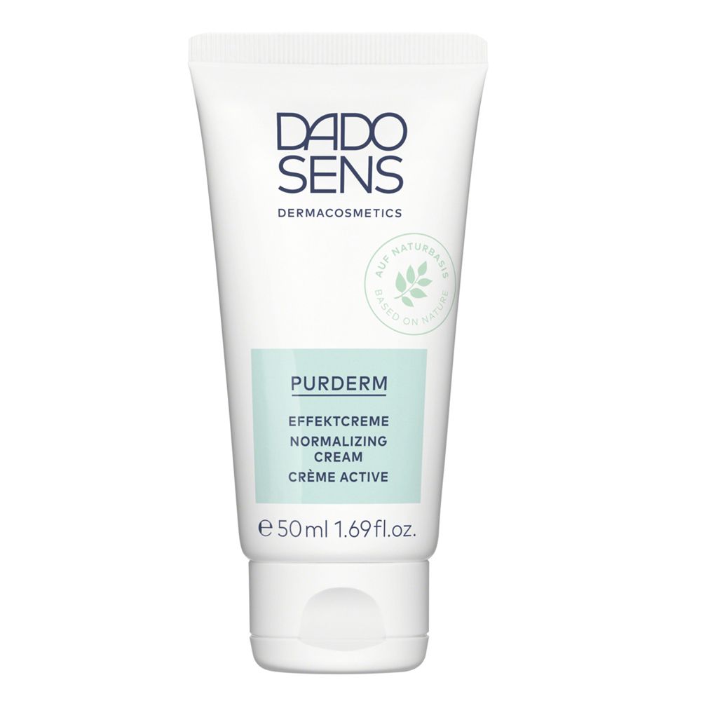 Witte tube met DADO SENS-logo en productnaam. Opschrift: PurDerm Effectcrème. Groen-witte kleurstelling.