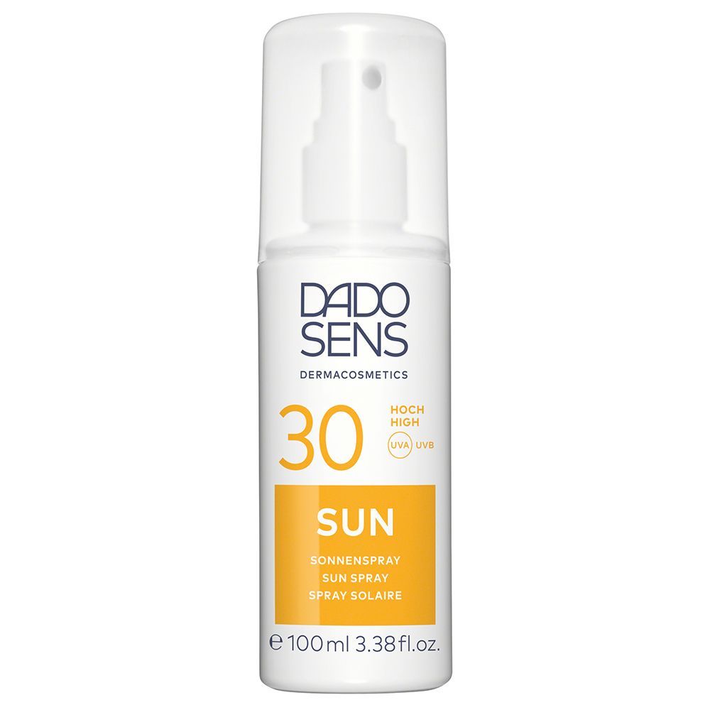 Witte zonnebrandspray met sproeikop. Opschrift: DADO SENS, 30, SUN, Sonnenspray. Gele sticker. 100ml.