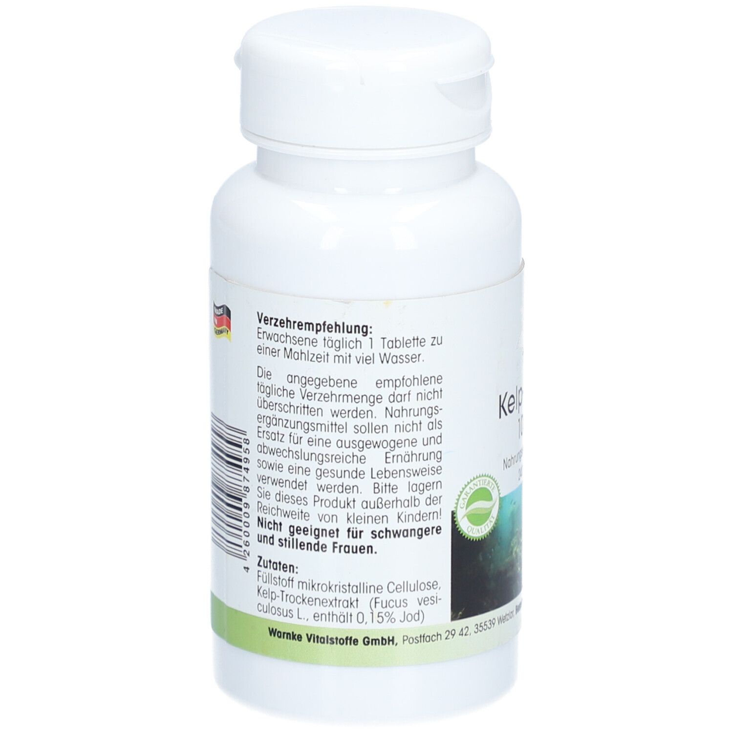 Achterkant witte fles. Tekst met aanbevelingen, ingrediënten en waarschuwingen. Groen etiket met logo.