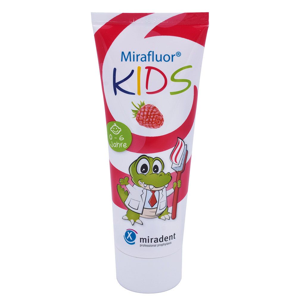 Tube de dentifrice Mirafluor KIDS. Motif : crocodile avec brosse à dents et framboise. Inscription : KIDS.