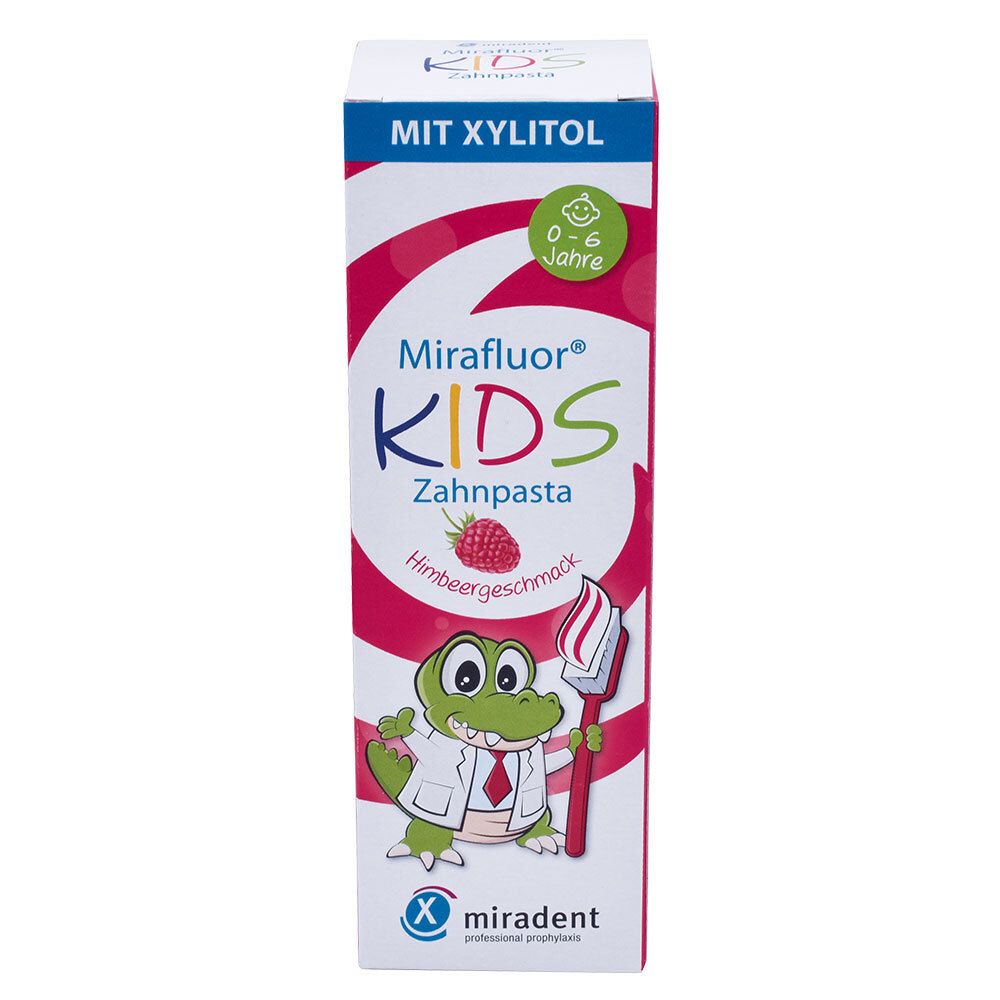 Emballage de dentifrice Mirafluor KIDS. Motif : crocodile avec brosse à dents et framboise. Inscription : KIDS.