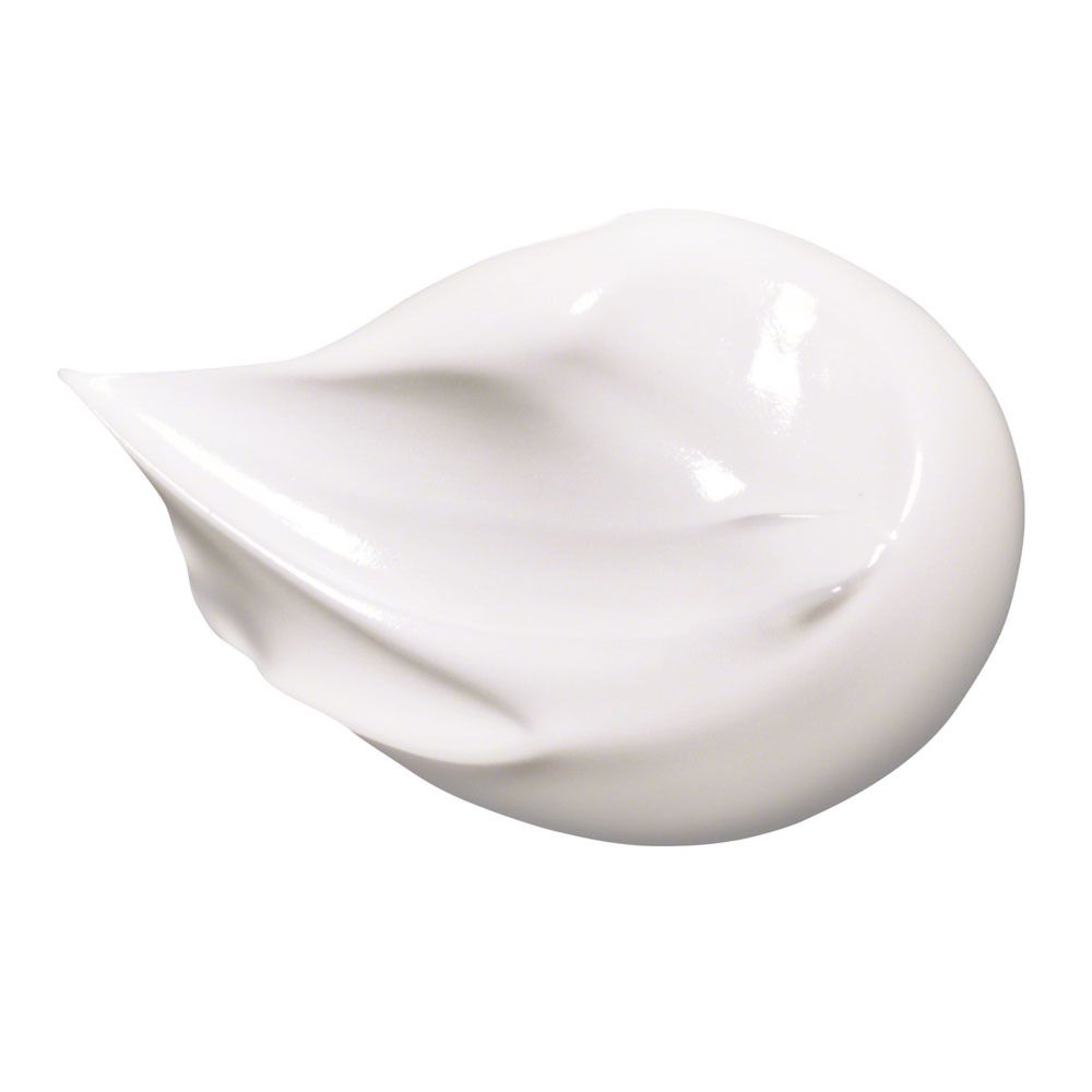 Éclaboussure de crème solaire blanche. Texture lisse. Sur fond blanc.