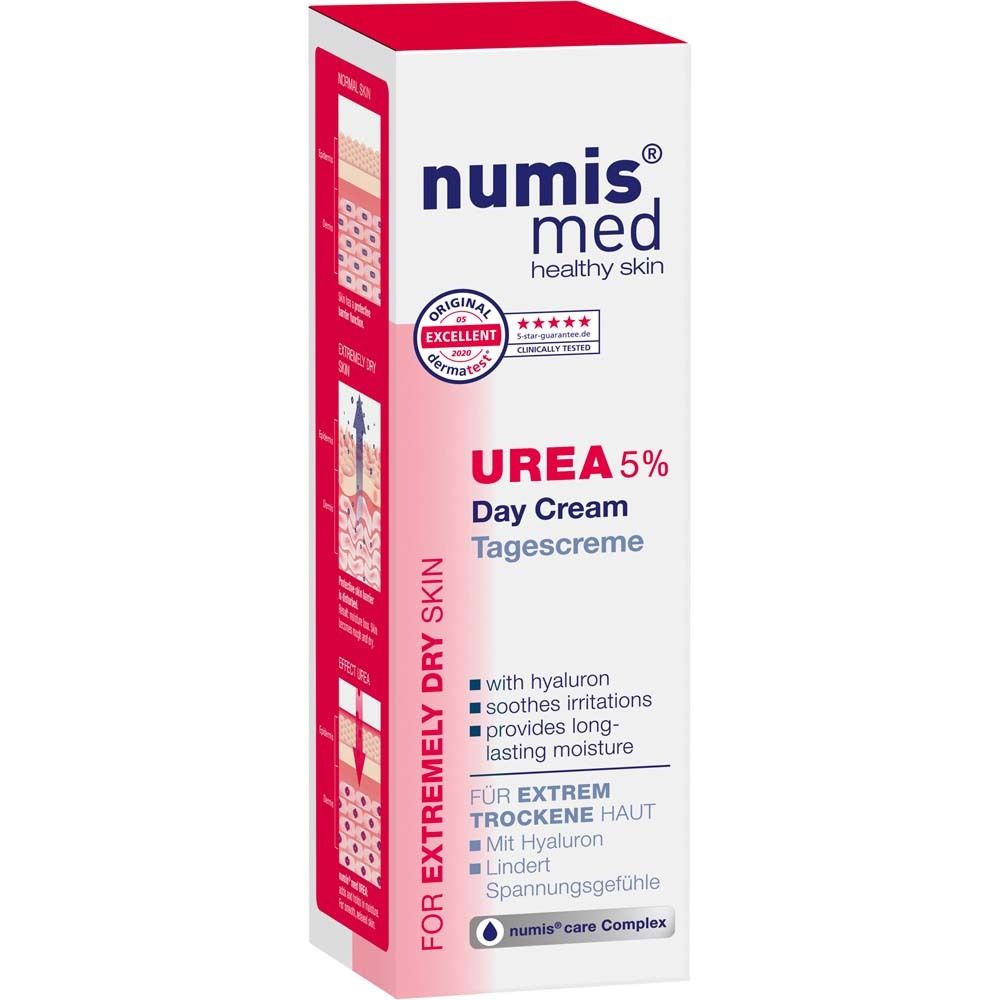 Crèmefles. Wit met rode dop. Opschrift: numis med, UREA 5% Dagcrème. Met hyaluron. Voor extreem droge huid.
