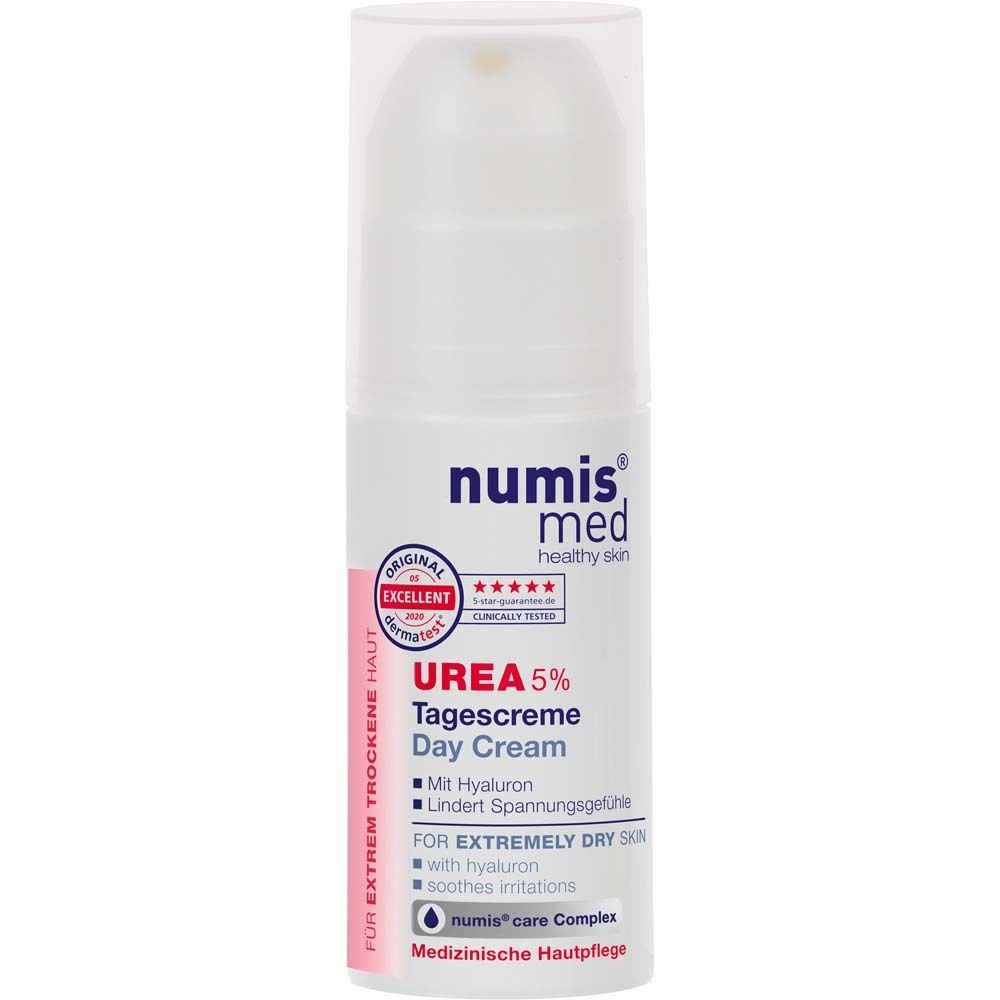 Verpakking. Wit met rode deksel. Opschrift: numis med, UREA 5% Dagcrème. Met hyaluron. Voor extreem droge huid. Dermatologisch getest.