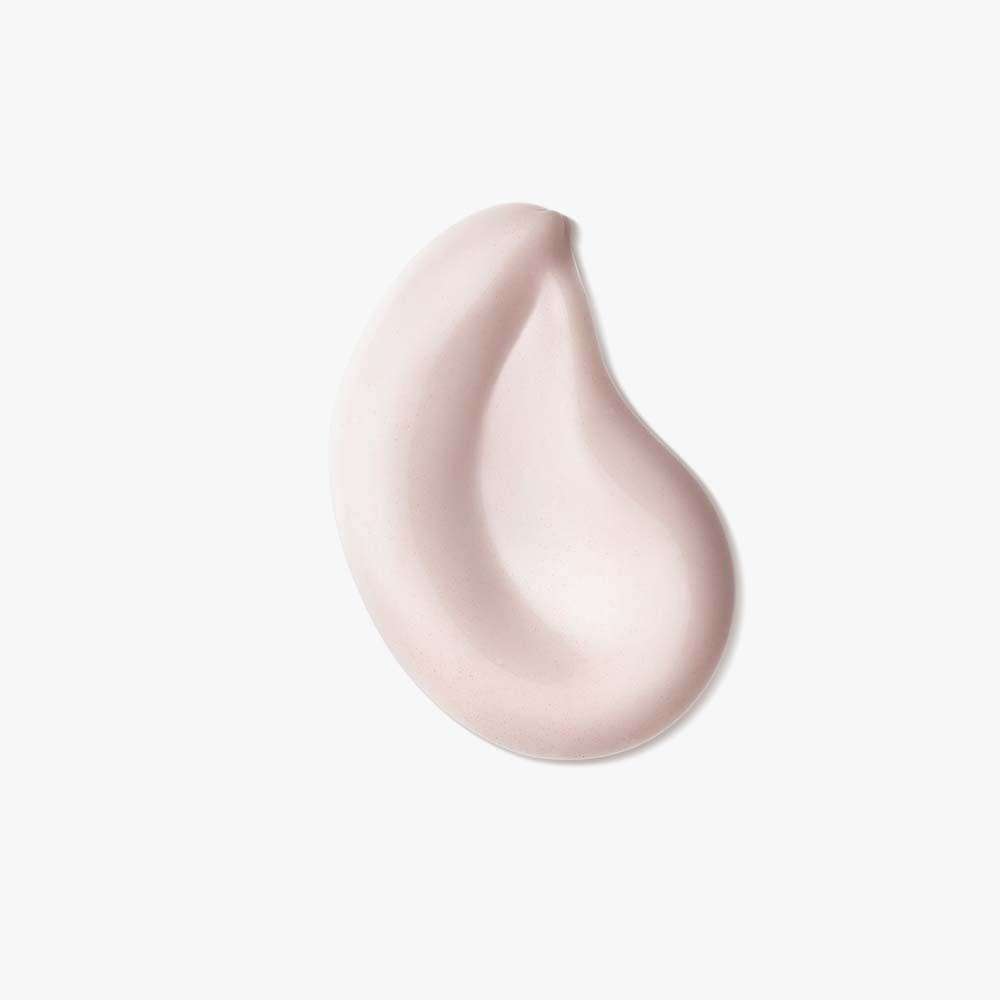 Roze crèmedruppel. Op witte achtergrond.