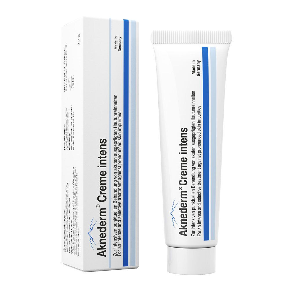Aknederm Creme intens tube en verpakking. Wit, blauwe accenten. Tekst: Creme intens, Made in Germany.