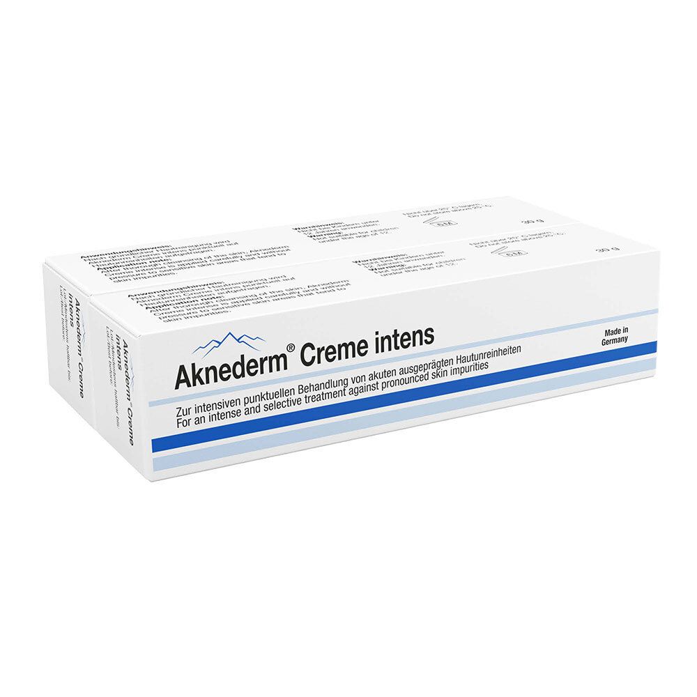 Doos Aknederm® Creme intens. Witte verpakking met blauwe tekst en logo. Tekst in het Duits en Engels.
