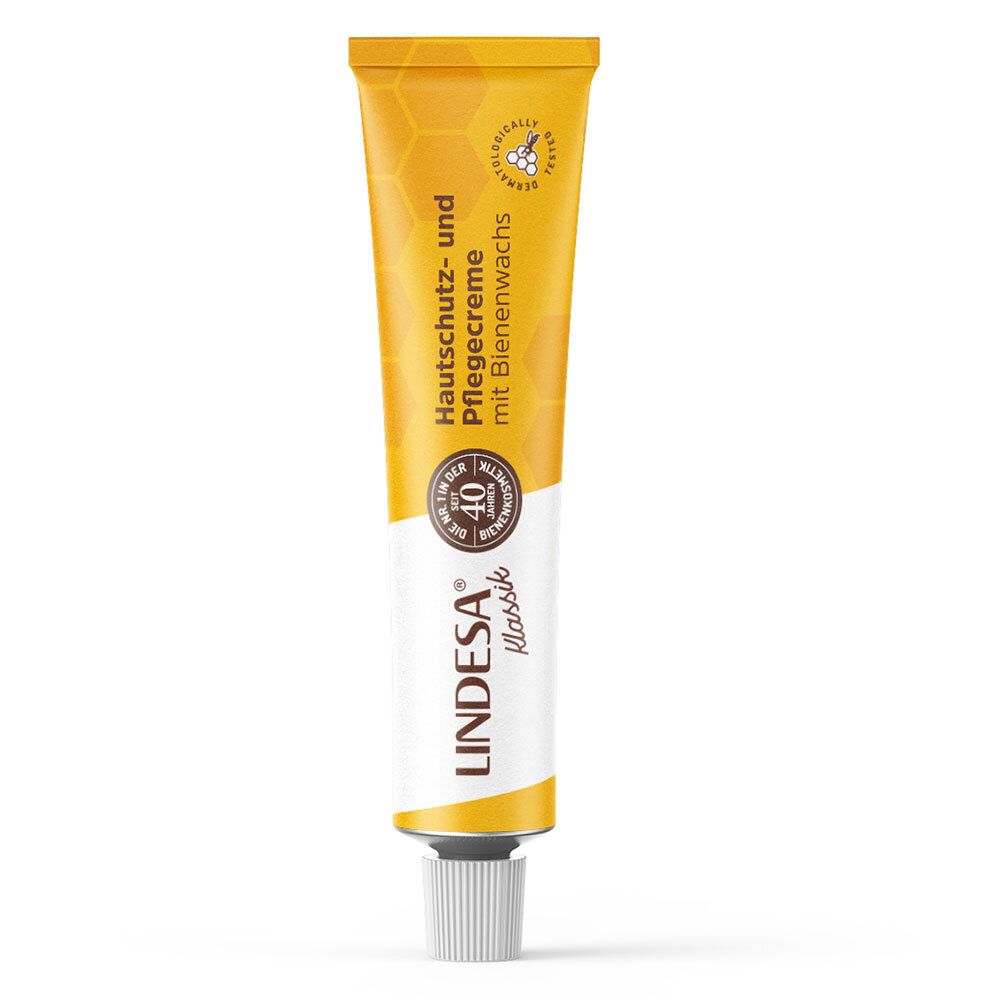Tube jaune avec bouchon blanc. Inscription: Crème protectrice et soin avec cire d'abeille. Logo: LINDESA® Klassik.