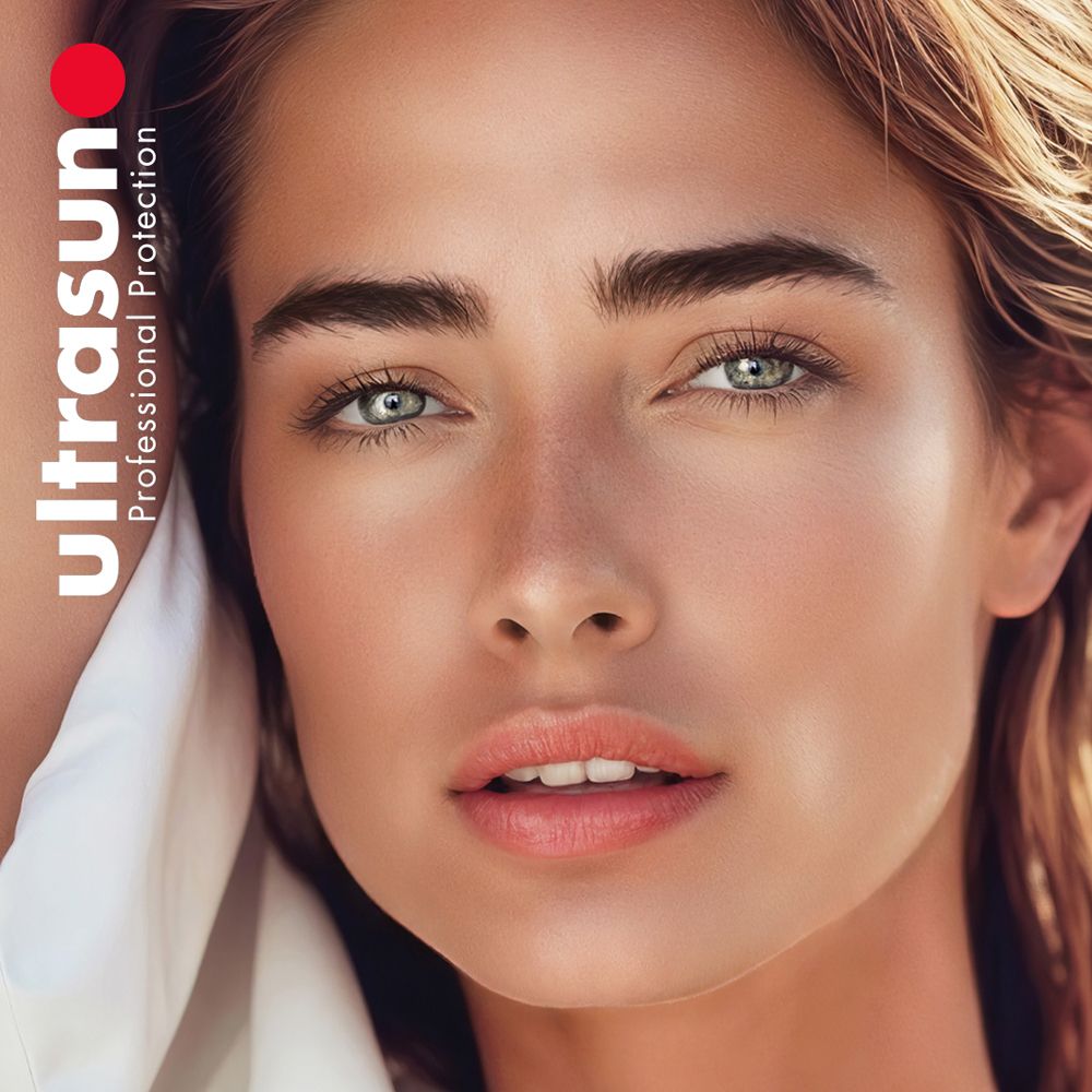 Close-up van een vrouw met een lichte huid. ultrasun Professional Protection logo. Gezicht met make-up, lichte ogen.