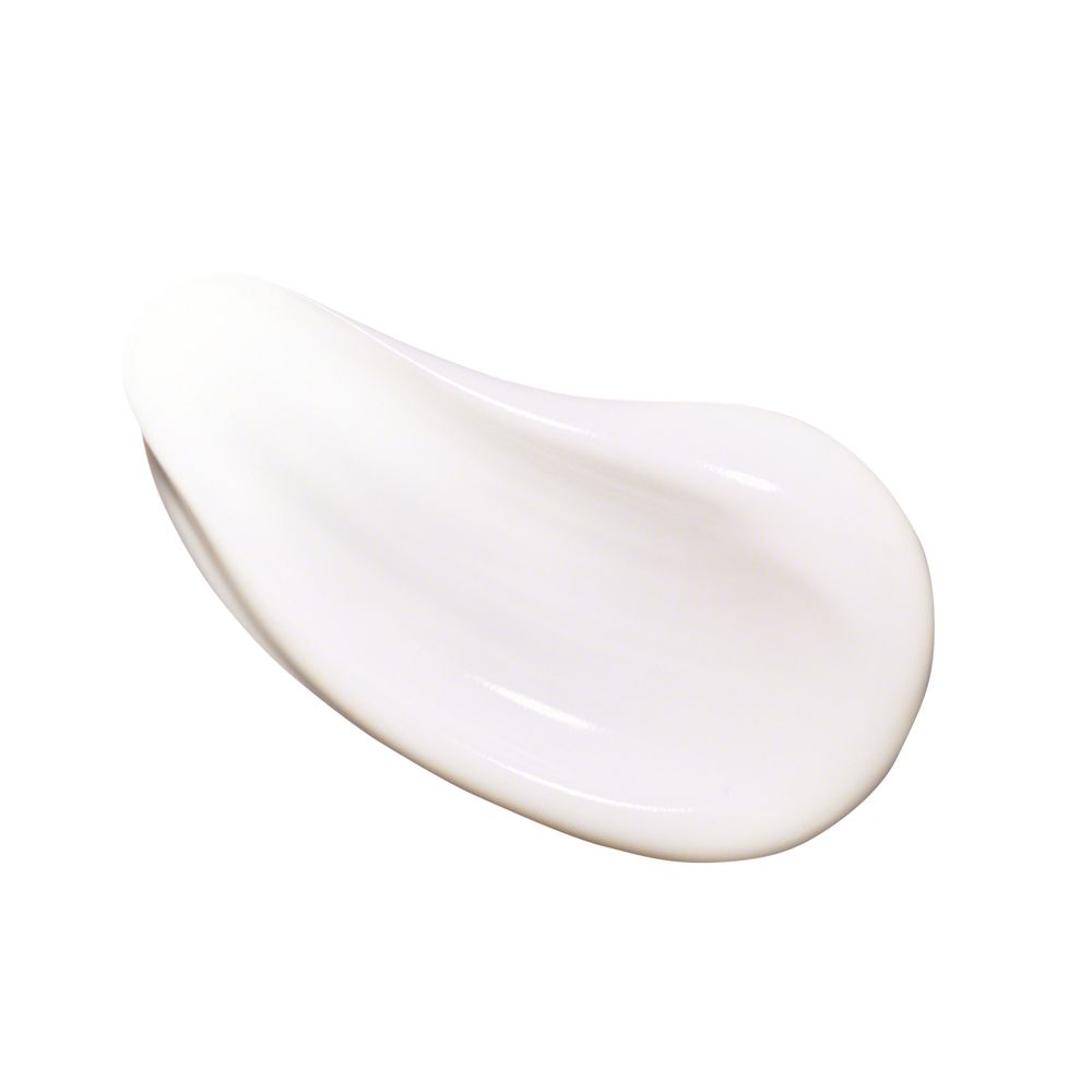 Gros plan d'une goutte de crème blanche. Texture lisse, légèrement brillante.