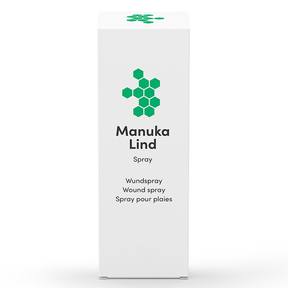 Doos met groen logo en tekst Manuka Lind Spray. Tekst: Wundspray, Wound spray, Spray pour plaies. Witte achtergrond.
