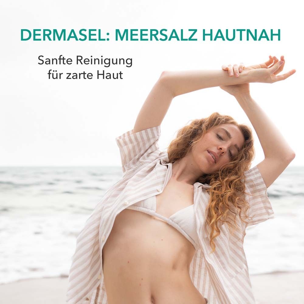 Vrouw op het strand. Tekst: DERMASEL: Zeezout dicht op de huid. Zachte reiniging voor de tere huid.
