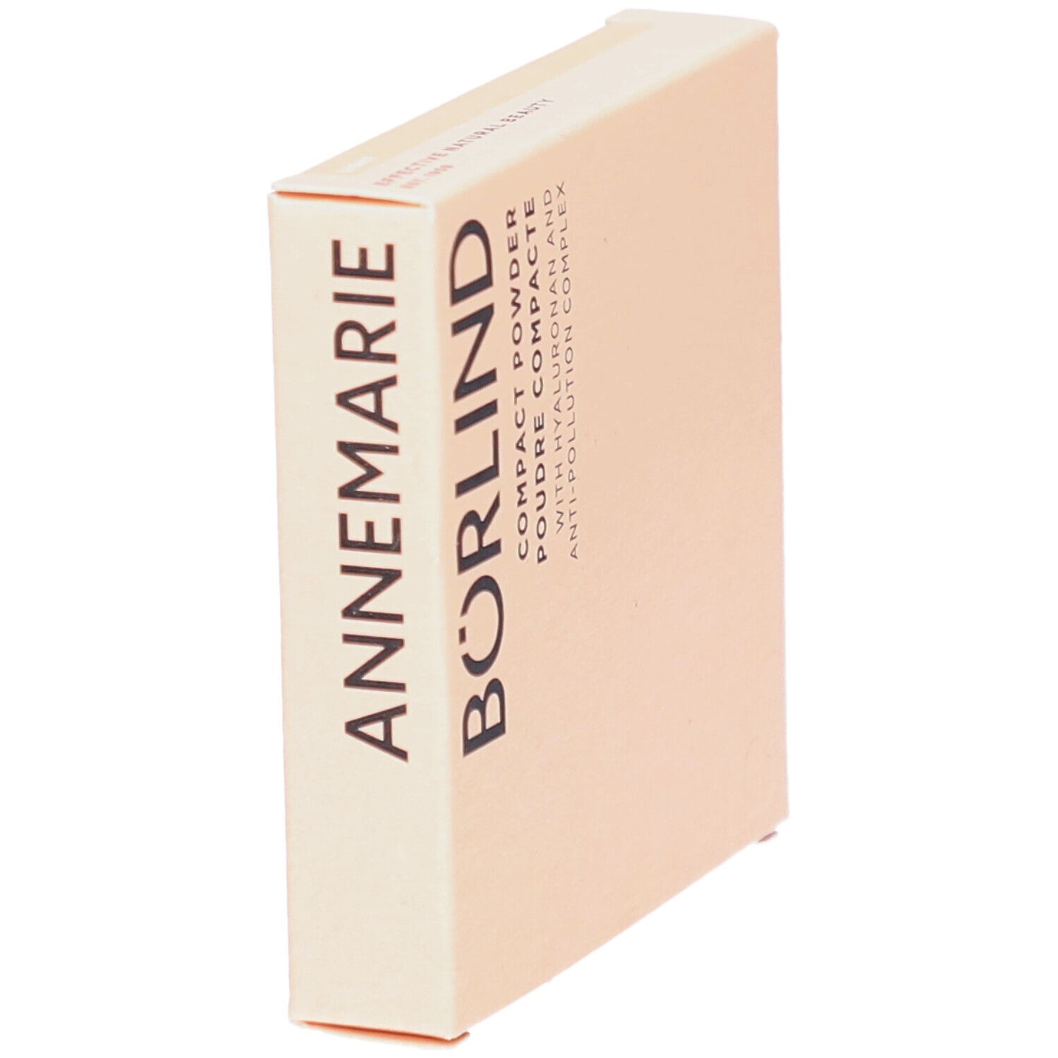 Boîte de poudre compacte en biais. Inscription noire ANNEMARIE BÖRLIND. Texte: COMPACT POWDER, POUDRE COMPACTE.