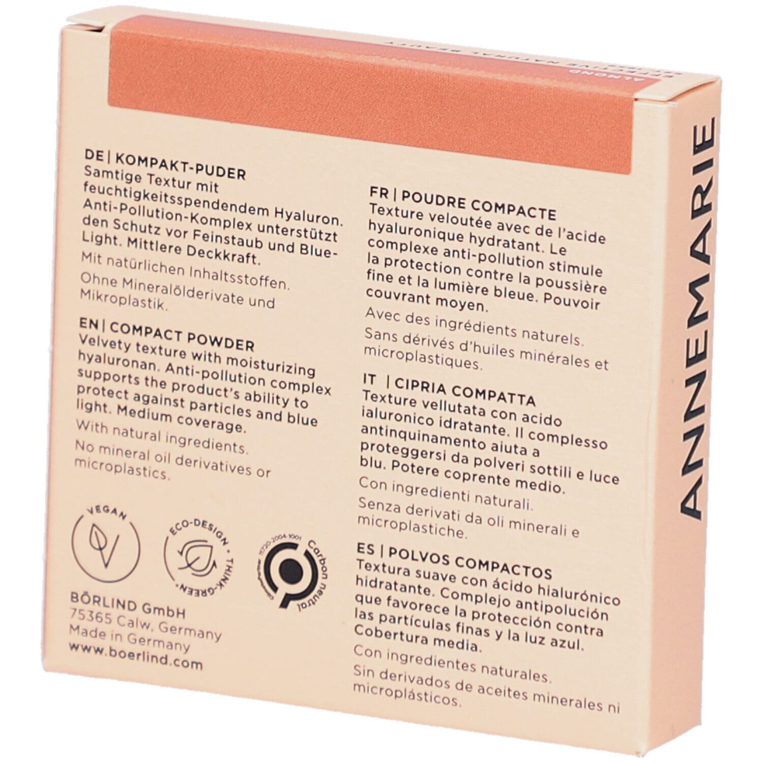 Dos de la boîte de poudre compacte. Texte en allemand, français, italien et espagnol. Logo vegan.