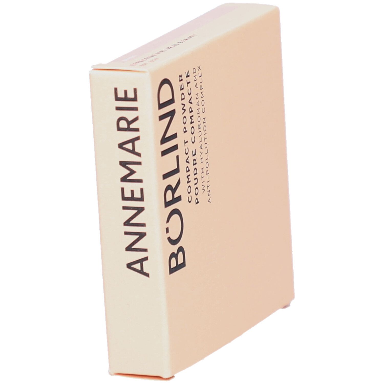 Boîte de poudre compacte. Carton beige avec le texte ANNEMARIE BÖRLIND. Texte: Compact Powder, Poudre Compacte, avec Hyaluron et Anti-Pollution Complex.