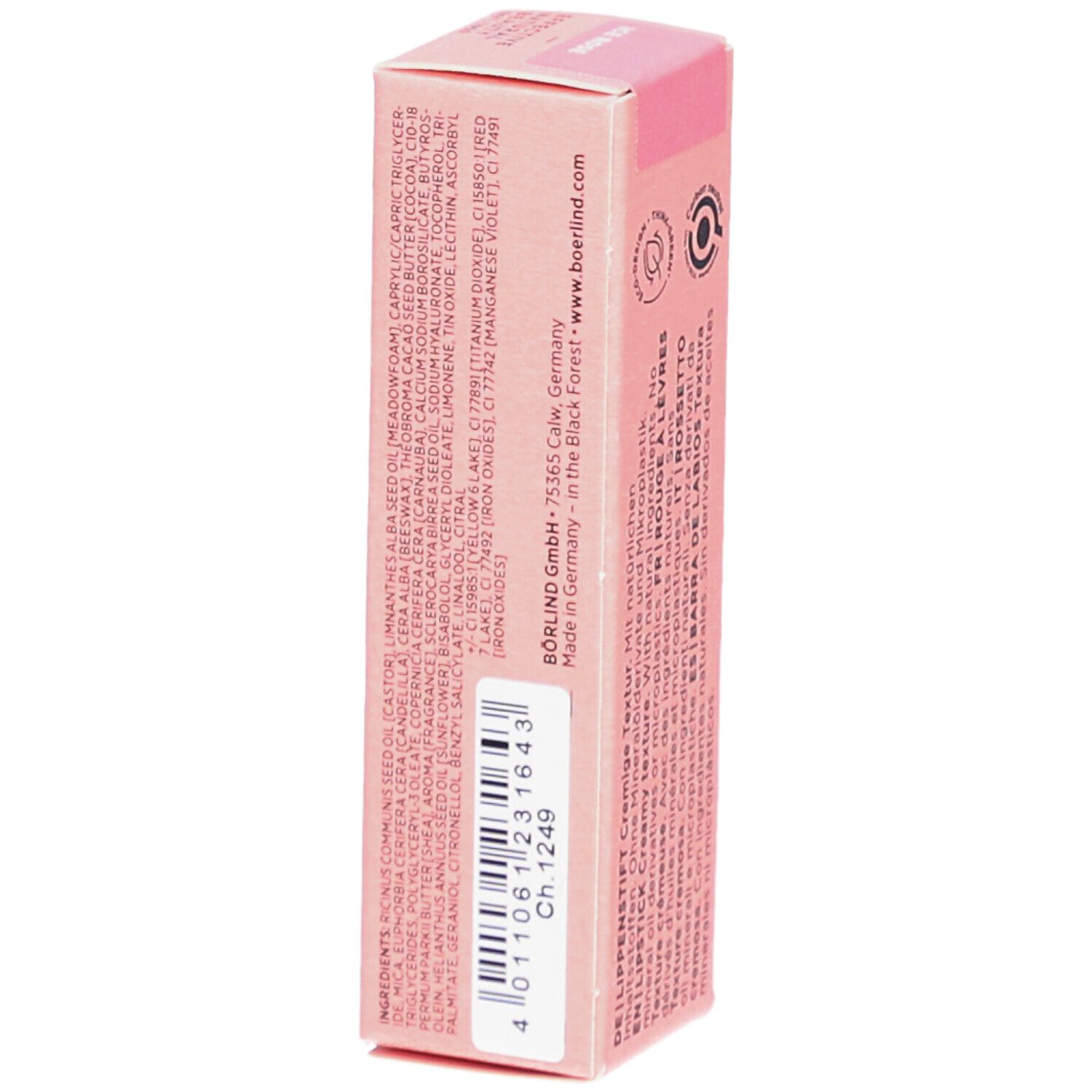 Emballage de rouge à lèvres rose. Inscription avec ingrédients, adresse du fabricant et logos. Code-barres avec numéro.