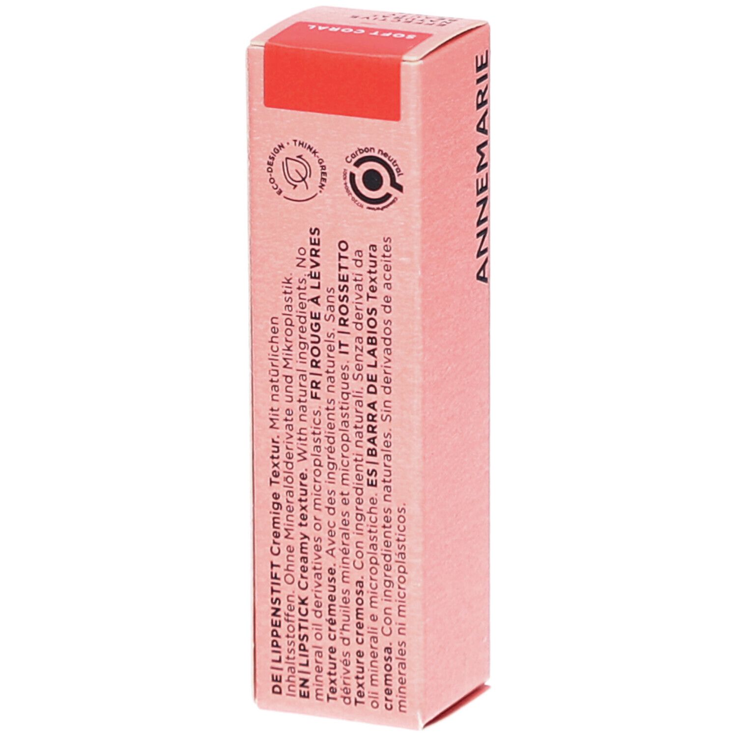 BÖRLIND lippenstiftverpakking. Roze doos met productinformatie. Opschrift: SOFT CORAL. Textuur.