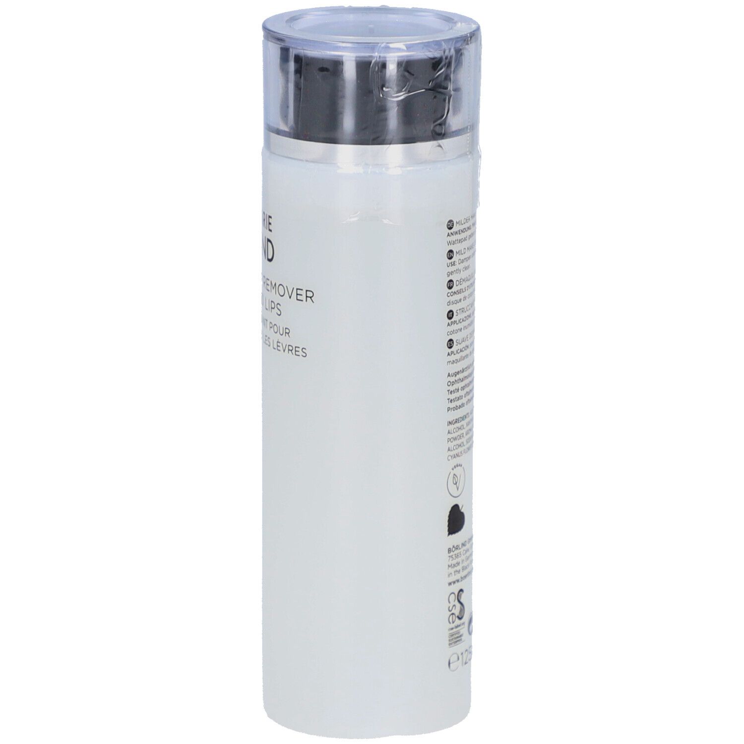 Flacon blanc avec bouchon argenté. Texte sur le côté. Nom du produit partiellement visible.