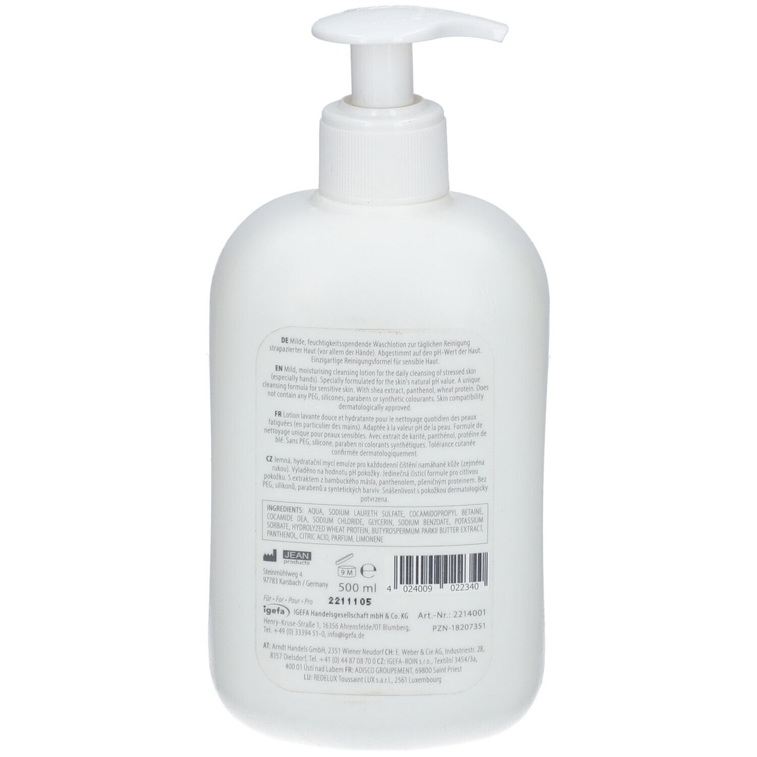 Achterkant van een witte fles met pomp. Tekst in meerdere talen. Ingrediënten en fabrikantgegevens.