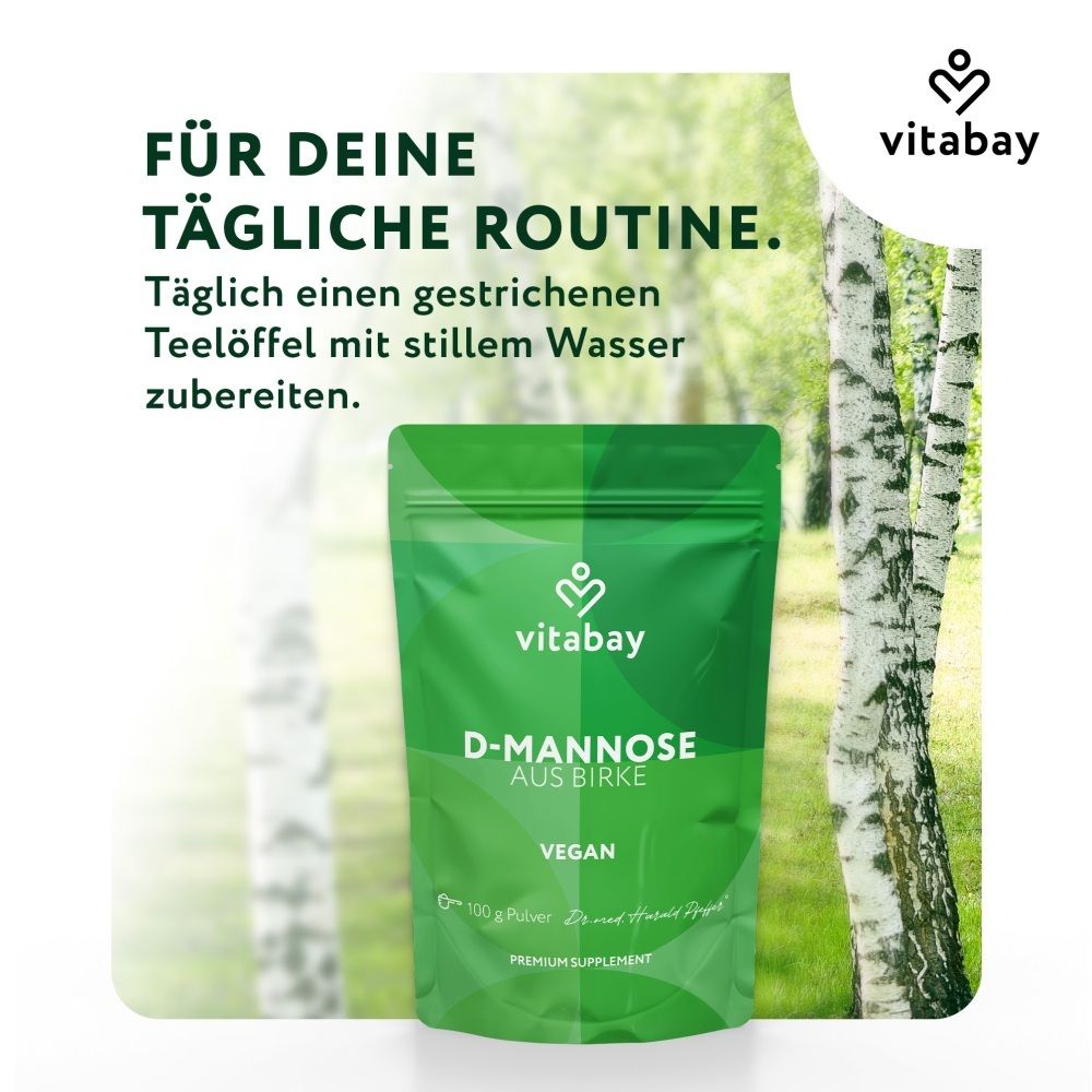 Sachet Vitabay D-Mannose de bouleau devant un bois de bouleaux. Routine quotidienne: 1 cuillère avec eau.