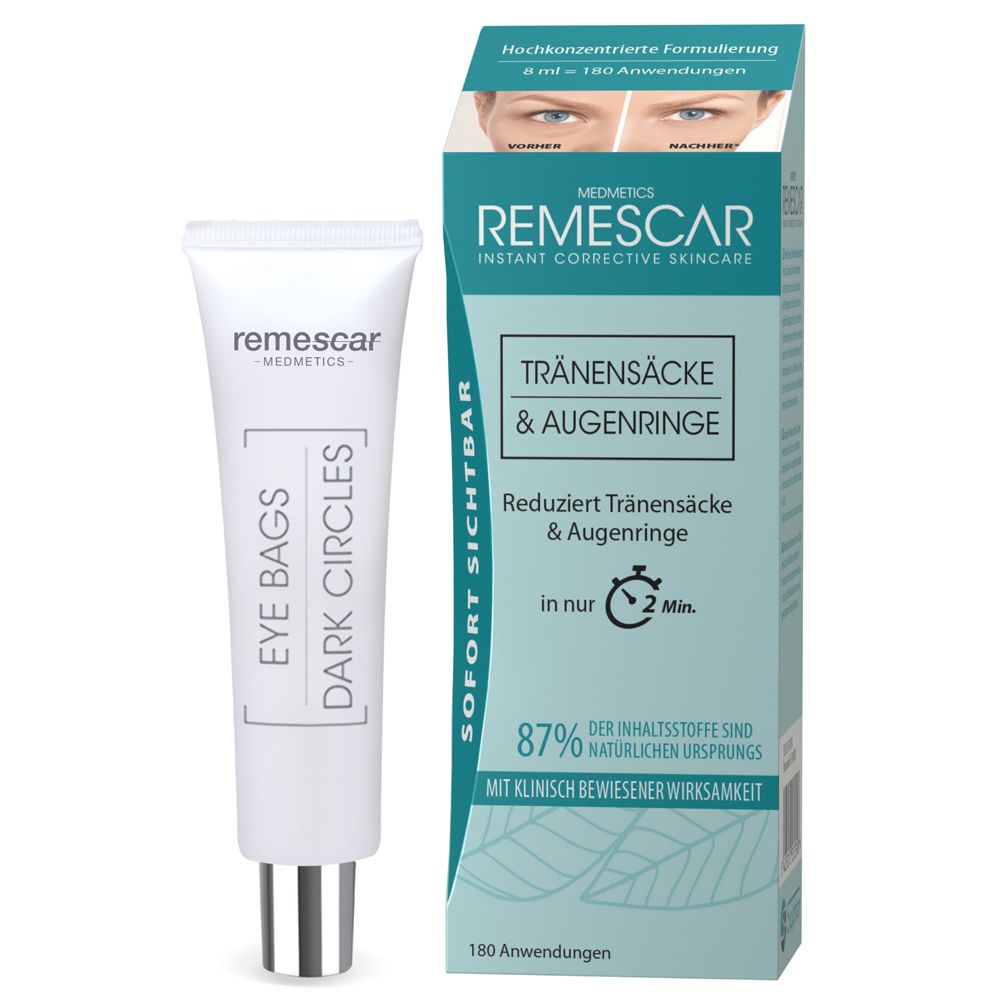 Tube avec texte et emballage du produit. Inscription : Eye Bags Dark Circles. Bouchon argenté.