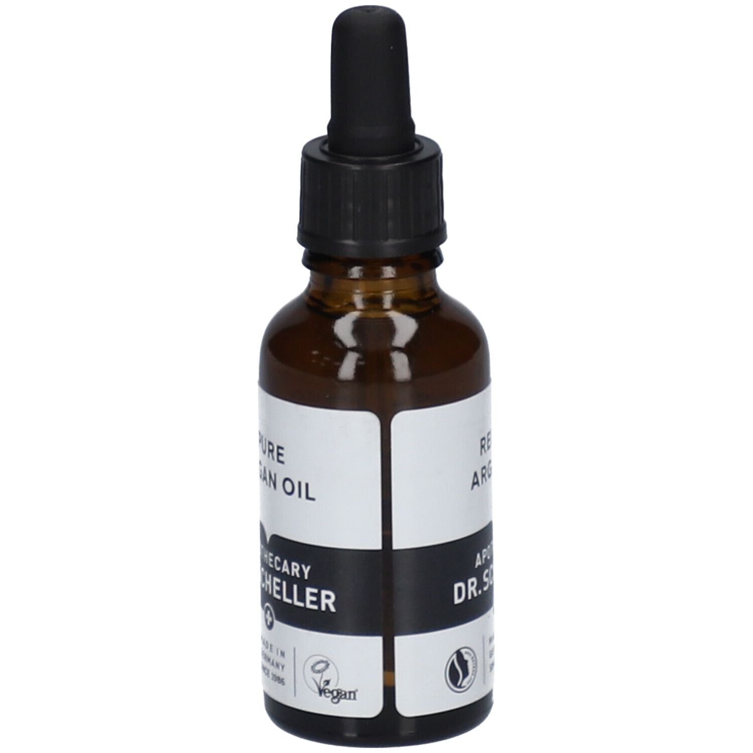 Bruine glazen fles met zwarte dop en pipet. Etiket met "REINES ARGANÖL" en "APOTHEKER DR.SCHELLER".